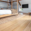 Sawn & Brushed Invisible Lacquered oak flooring in bedroom