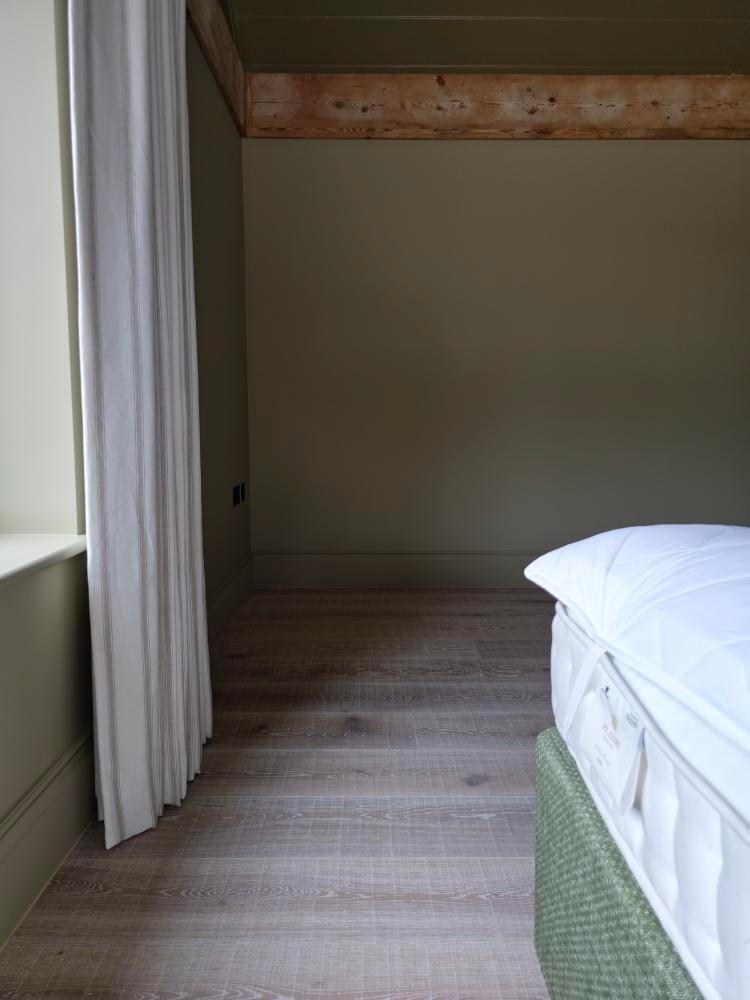Sawn and Brushed light oak flooring in bedroom