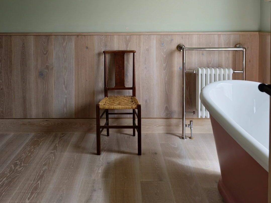 Sawn and Brushed light oak flooring in master bathroom suite