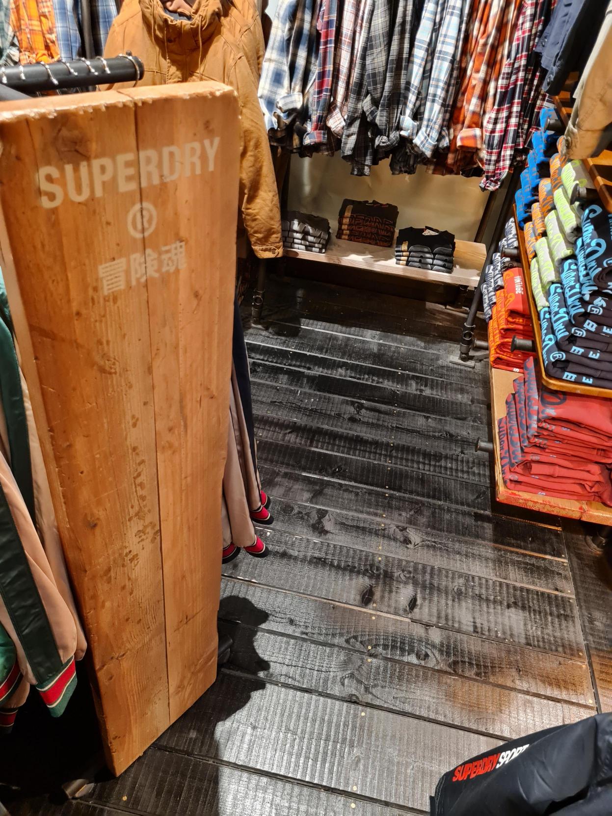 Black Stained Rough Sawn Pine at Superdry Battersea